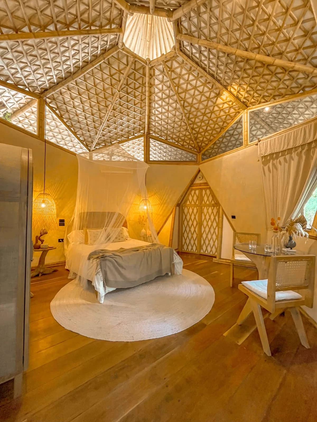 Interior of a handbuilt sacred-geometry bamboo dome suite at Mauna Tulum